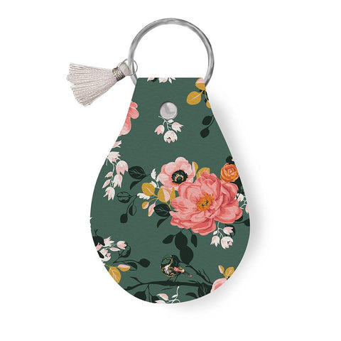 Image of the Leather Circle Key Chain Porch Swing by Ashley Collett for Riley Blake Designs. Features a pink flower design on a full grain leather keychain with tassle. 
Cute Little Fabric Shop