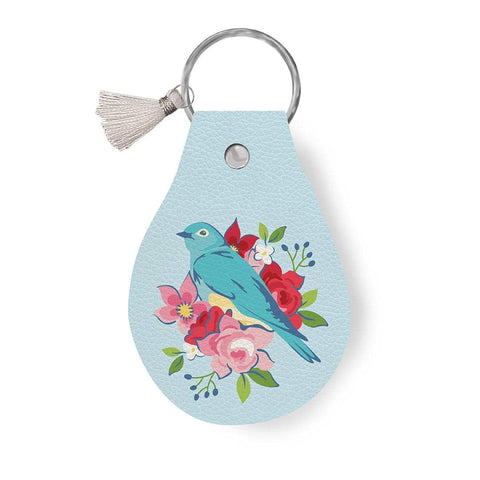 Image of the Leather Circle Key Chain Bluebird by Ashley Collett for Riley Blake Designs. Features a bird design on a full grain leather keychain with tassel. 
Cute Little Fabric Shop