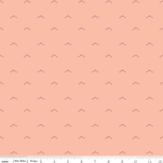 Image of the Garden Dreams Shimmer Peaches 'n Cream quilting cotton fabric by Amber Elliot for Riley Blake Designs. Features eyelash shapes scattered on a light pink coral background. 
Cute Little Fabric Shop