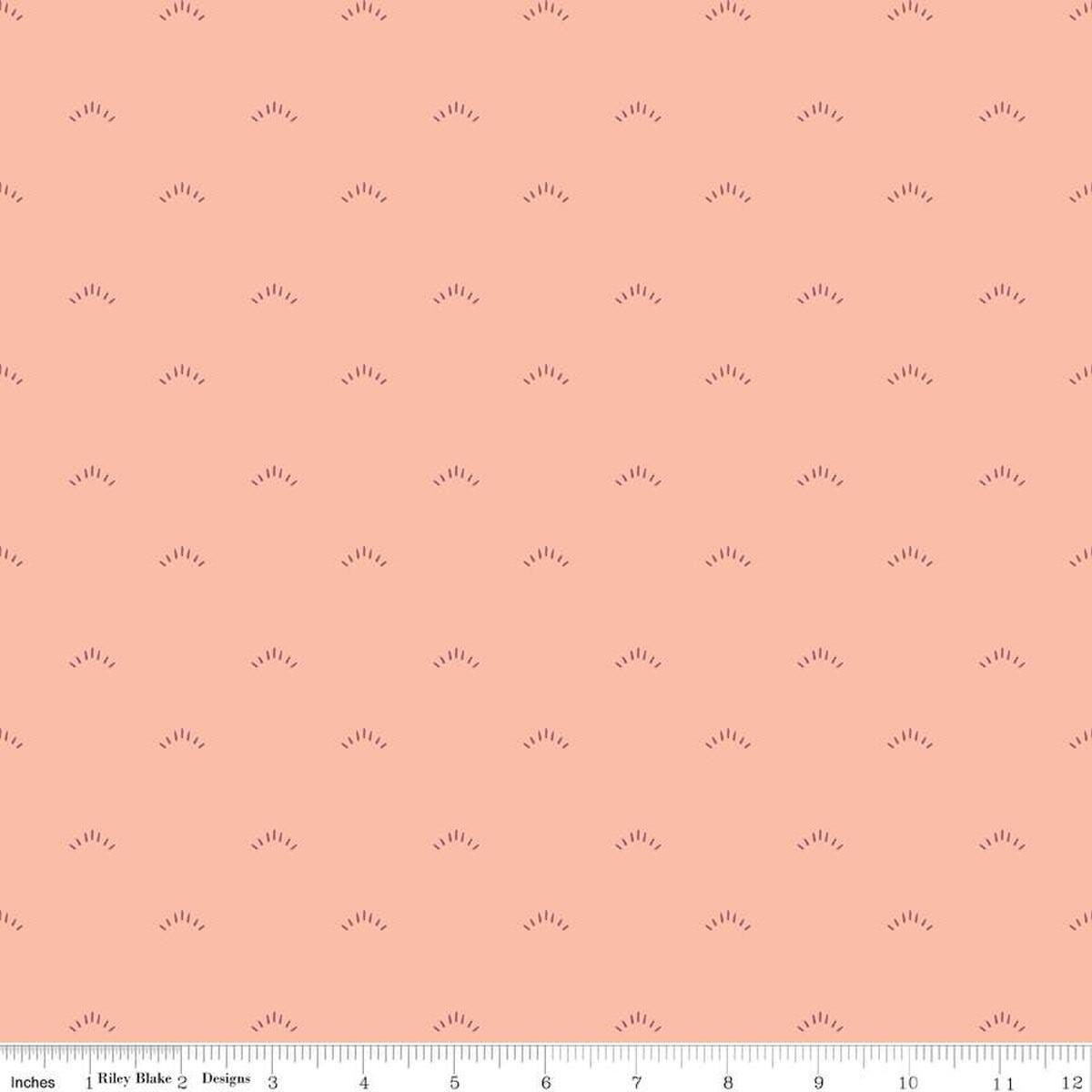 Image of the Garden Dreams Shimmer Peaches 'n Cream quilting cotton fabric by Amber Elliot for Riley Blake Designs. Features eyelash shapes scattered on a light pink coral background. 
Cute Little Fabric Shop