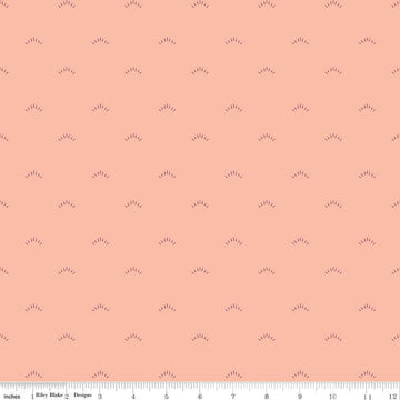 Image of the Garden Dreams Shimmer Peaches 'n Cream quilting cotton fabric by Amber Elliot for Riley Blake Designs. Features eyelash shapes scattered on a light pink coral background. 
Cute Little Fabric Shop