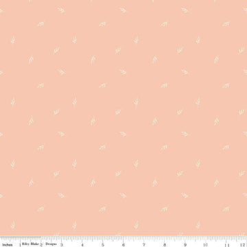 Image of the Garden Dreams Leaf Toss Peaches 'n Cream quilting cotton fabric by Amber Elliot for Riley Blake Designs. Features leaves scattered on a light pink orange background. 
Cute Little Fabric Shop