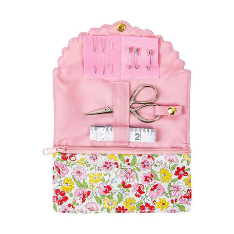 Image of the Liberty Fabrics Fabric Sewing Roll Floral Joy by Lori Holt Fabric Shop. Features a pink case with 1 embroidery scissors, 1 tape measure, 3 safety pins, and 3 needles. 
Cute Little Fabric Shop