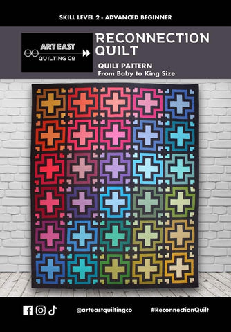 Image of the Reconnection quilt by the Art East Quilting Co for Riley Blake Designs. Features a rainbow quilt with plus signs. 
Cute Little Fabric Shop