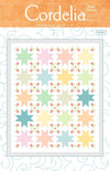 Image of the Cordelia Quilt Pattern by Wendy Sheppard for Riley Blake Designs. Features star patterns with flowers. 
Cute Little Fabric Shop