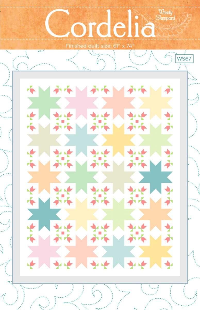 Image of the Cordelia Quilt Pattern by Wendy Sheppard for Riley Blake Designs. Features star patterns with flowers. 
Cute Little Fabric Shop