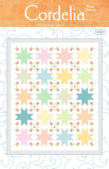 Image of the Cordelia Quilt Pattern by Wendy Sheppard for Riley Blake Designs. Features star patterns with flowers. 
Cute Little Fabric Shop
