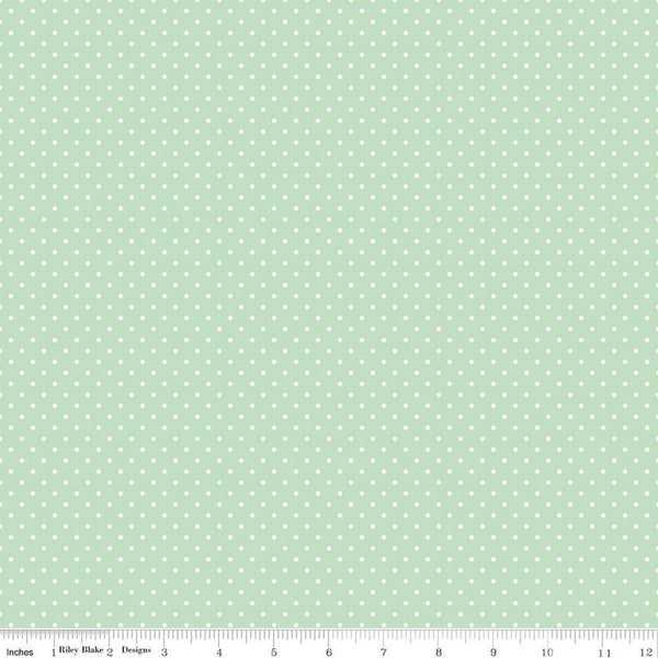 Image of the Swiss Dot Sweet Mint quilting cotton fabric by The RBD Designers for Riley Blake Designs. Features white dots on light green swiss dots. 
Cute Little Fabric Shop