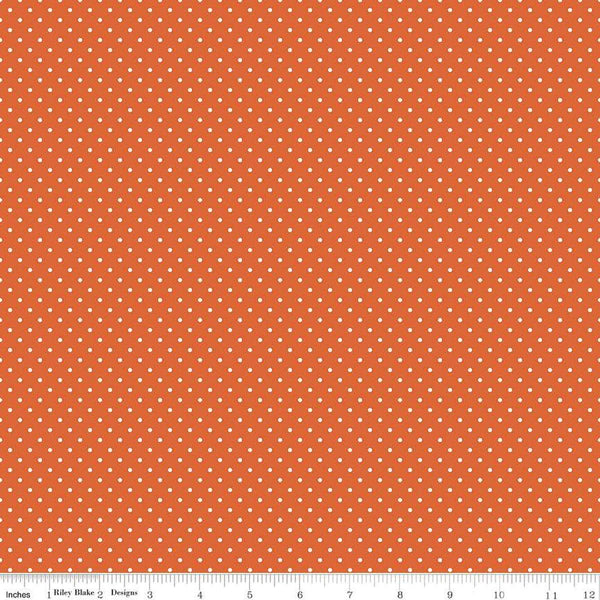 Image of the Swiss Dot Autumn quilting cotton fabric by The RBD Designers for Riley Blake Designs. Features white dots on orange swiss dots. 
Cute Little Fabric Shop