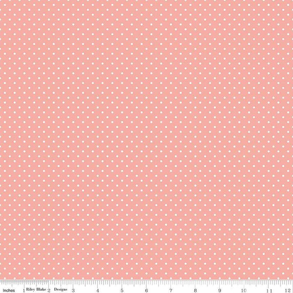 Image of the Swiss Dot Apricot Blush quilting cotton fabric by The RBD Designers for Riley Blake Designs. Features white dots on pink swiss dots. 
Cute Little Fabric Shop