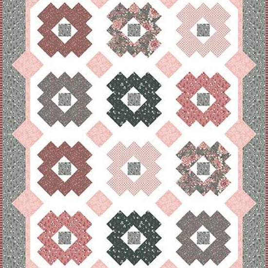Image of the Daisy Patch quilt pattern by It's Sew Emma for Riley Blake Designs. Features a quilt with pink and grey fabrics. 
Cute Little Fabric Shop