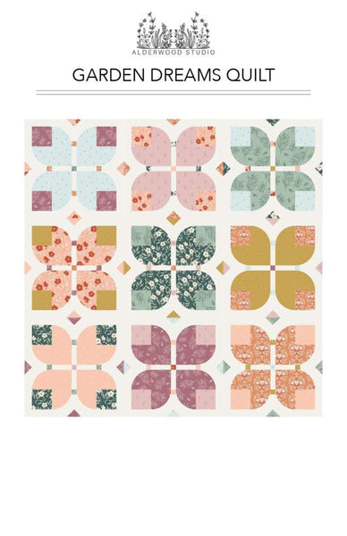 Image of the Garden Dreams quilt pattern by Amber Elliot of Alderwood Studio for Riley Blake Designs. Features flower patterns on a white background quilt. 
Cute Little Fabric Shop