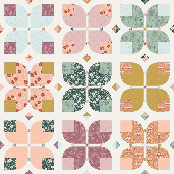 Image of the Garden Dreams quilt pattern by Amber Elliot of Alderwood Studio for Riley Blake Designs. Features flower patterns on a white background quilt. 
Cute Little Fabric Shop