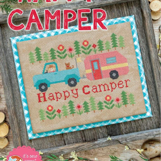 Image of the Happy Camper Cross Stitch Pattern by It's Sew Emma for Riley Blake Designs. 
Features a truck and camper cross stitched onto beige fabric. 
Cute Little Fabric Shop