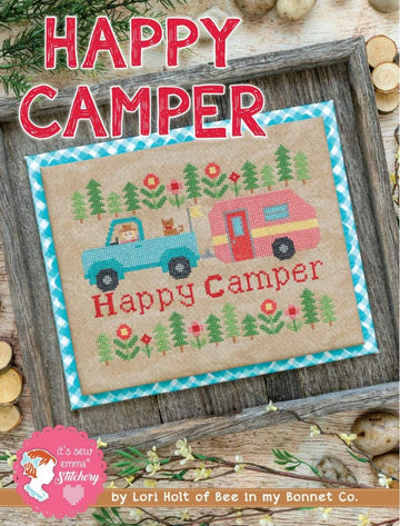 Image of the Happy Camper Cross Stitch Pattern by It's Sew Emma for Riley Blake Designs. 
Features a truck and camper cross stitched onto beige fabric. 
Cute Little Fabric Shop