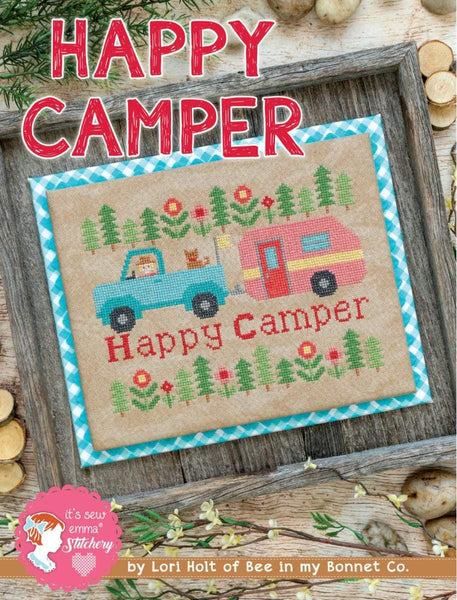 Image of the Happy Camper Cross Stitch Pattern by It&#39;s Sew Emma for Riley Blake Designs. 
Features a truck and camper cross stitched onto beige fabric. 
Cute Little Fabric Shop