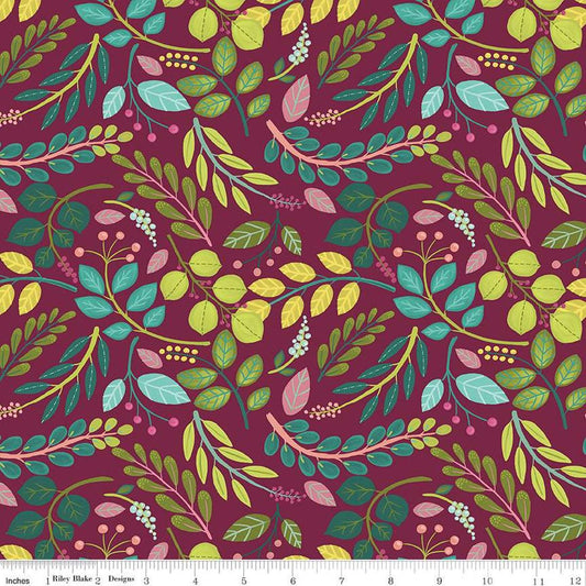 Image of the Fragrant Fields Sprigs Maroon quilting cotton fabric by Lila Tueller for Riley Blake Designs. Features leaves and stems on a dark pink purple background. 
Cute Little Fabric Shop