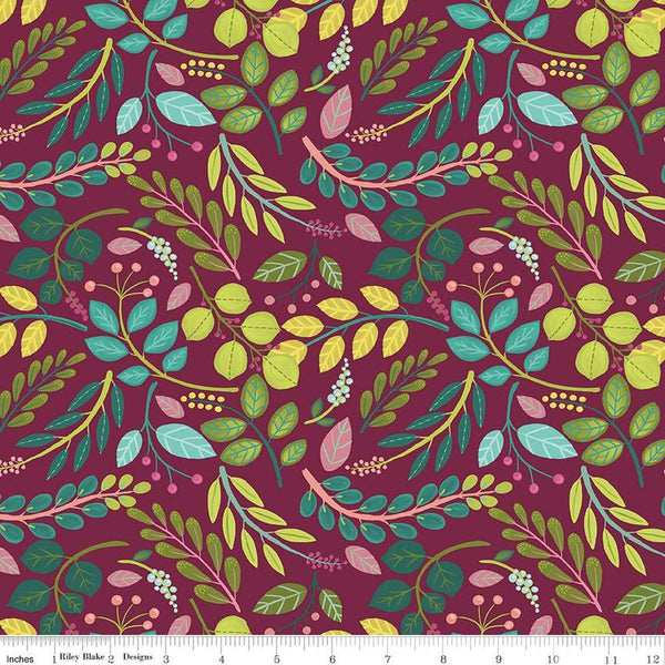 Image of the Fragrant Fields Sprigs Maroon quilting cotton fabric by Lila Tueller for Riley Blake Designs. Features leaves and stems on a dark pink purple background. 
Cute Little Fabric Shop