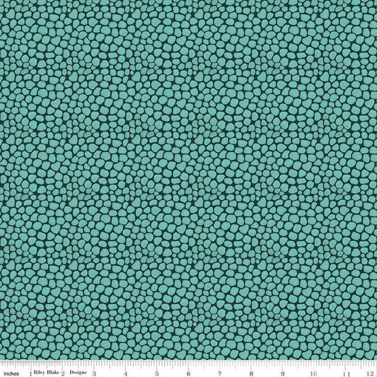 Image of the Fragrant Fields Stony Path Dark Forest quilting cotton fabric by Lila Tueller for Riley Blake Designs. Features small tone on tone stones on a dark teal blue background. 
Cute Little Fabric Shop