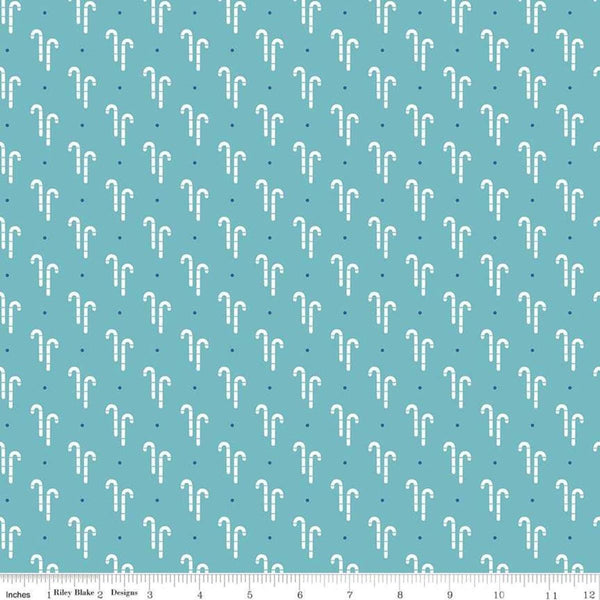 Image of the Cozy Christmas Candy Cane Blue quilting cotton fabric by Riley Blake Designs. Features white candy canes on a blue background. 
Cute Little Fabric Shop