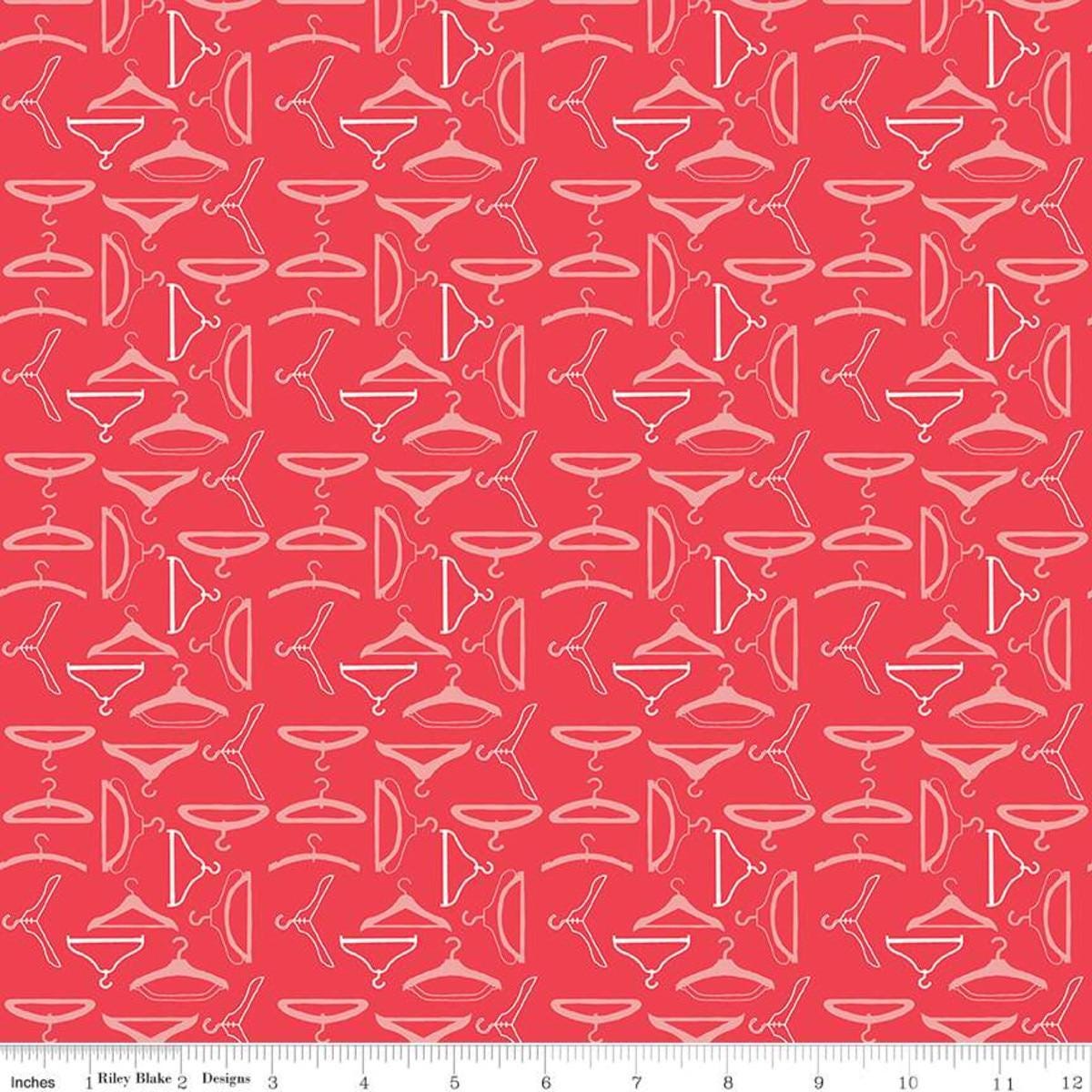 Image of the Vintage Happy 2 Hangers Cayenne quilting cotton fabric by Lori Holt for Riley Blake Designs. Features clothing hangers on a bright coral pink background.  
Cute Little Fabric Shop