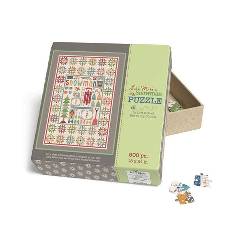 Image of the Let&#39;s Make a Snowman Puzzle by Lori Holt for Riley Blake Designs. Features a 500 piece puzzle with a snowman quilt. 
Cute Little Fabric Shop