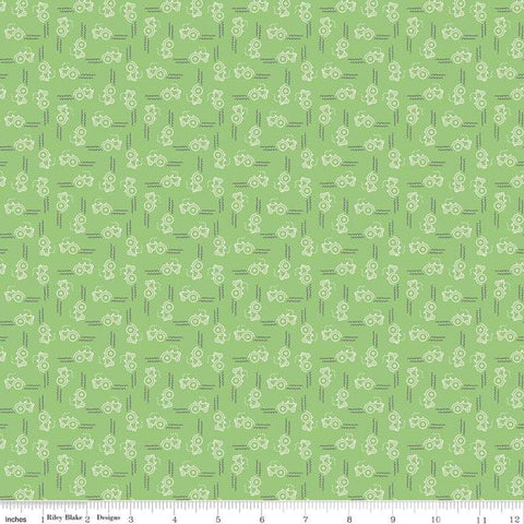 Image of the Farm Girl Vintage Companion Prints Tractor Riley Green quilting cotton fabric by Lori Holt for Riley Blake Designs. Features tractors on a light green background. 
Cute Little Fabric Shop