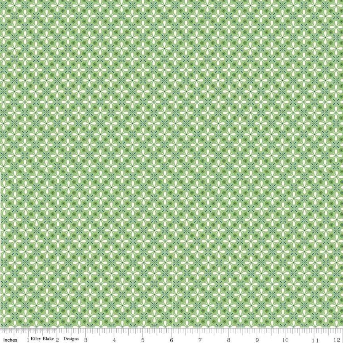 Image of the Farm Girl Vintage Vintage Green quilting cotton fabric by Lori Holt for Riley Blake Designs. Features a geometric print of repeating flower petals on a green background. 
Cute Little Fabric Shop