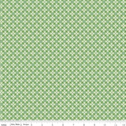 Image of the Farm Girl Vintage Vintage Green quilting cotton fabric by Lori Holt for Riley Blake Designs. Features a geometric print of repeating flower petals on a green background. 
Cute Little Fabric Shop