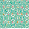 Image of the Granny Chic Curtains Teal quilting cotton fabric by Lori Holt for Riley Blake Designs. Features a flower bordered by a circle of small white flowers on a mint background. 
Cute Little Fabric Shop