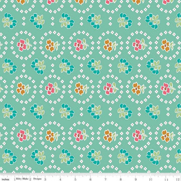 Image of the Granny Chic Curtains Teal quilting cotton fabric by Lori Holt for Riley Blake Designs. Features a flower bordered by a circle of small white flowers on a mint background. 
Cute Little Fabric Shop