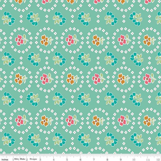 Image of the Granny Chic Curtains Teal quilting cotton fabric by Lori Holt for Riley Blake Designs. Features a flower bordered by a circle of small white flowers on a mint background. 
Cute Little Fabric Shop