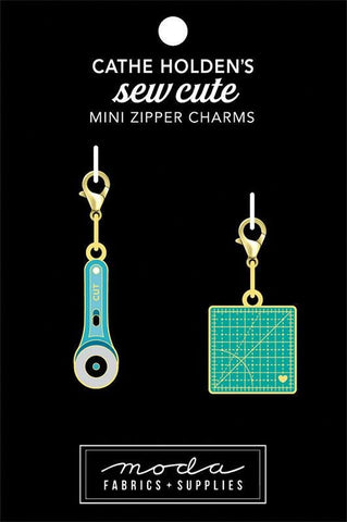 Image of the Cathe Holden&#39;s Sew Cute Mini Zipper charms for Moda Fabrics. Features a rotary blade and mat, set of 2. 
Cute Little Fabric Shop