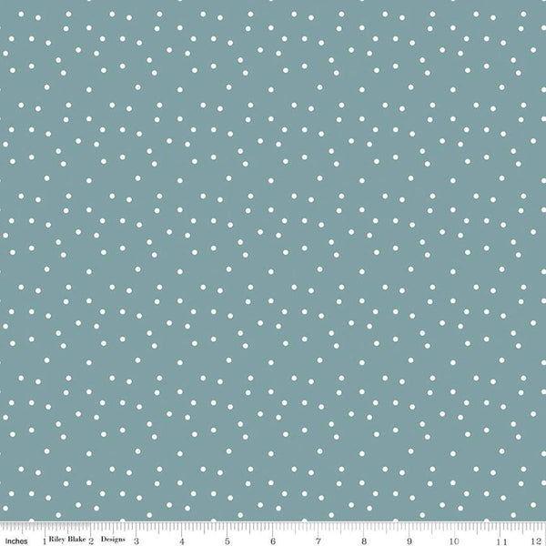 Image of the Vintage Charm Dots Stone quilting cotton fabric by Dani Mogstad for Riley Blake Designs. Features scattered small dots on a dusty blue background. 
Cute Little Fabric Shop