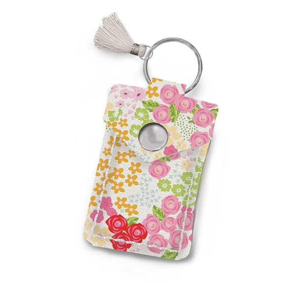 Image of the Leather Scissor Pouch Picnic Florals by Sandy Gervais for Riley Blake Designs. Features a white case with pink flowers on it. 
Cute Little Fabric Shop