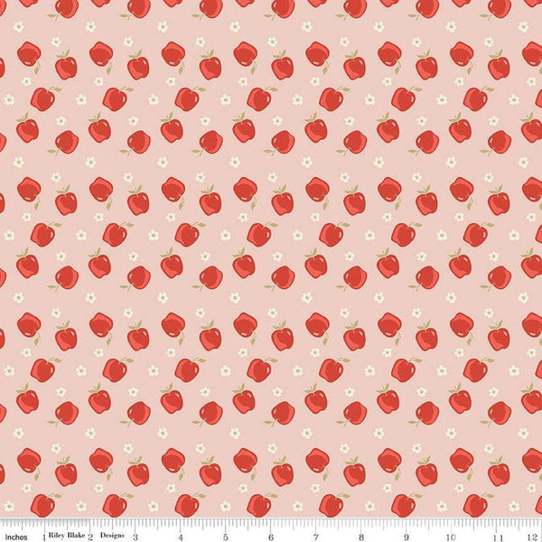 Image of the Vintage Charm Apples Blush quilting cotton fabric by Dani Mogstad for Riley Blake Designs. Features scattered apples and blossoms on a light pink background. 
Cute Little Fabric Shop