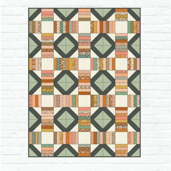 Image of the Wildwood pattern by Amber Johnson for Riley Blake Designs. Features striped lines and squares on the quilt. 
Cute Little Fabric Shop