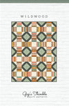 Image of the Wildwood pattern by Amber Johnson for Riley Blake Designs. Features striped lines and squares on the quilt. 
Cute Little Fabric Shop