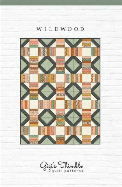 Image of the Wildwood pattern by Amber Johnson for Riley Blake Designs. Features striped lines and squares on the quilt. 
Cute Little Fabric Shop