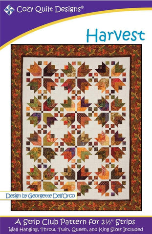 Image of the Harvest quilt pattern by Cozy Quilt Designs for Riley Blake Designs. Features a fall themed quilt on a cream background with a brown border. 
Cute Little Fabric Shop