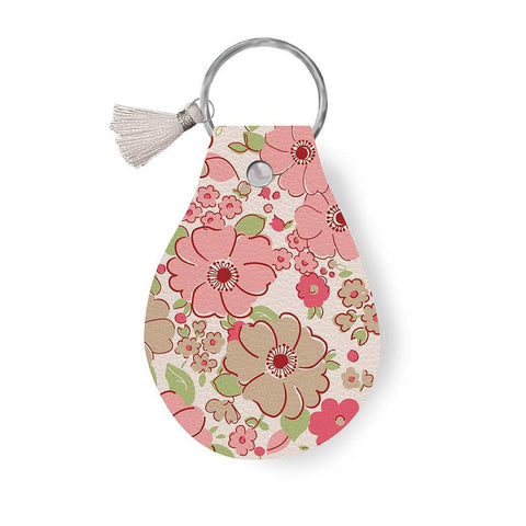 Image of the Leather Circle Key Chain Mercantile by Ashley Collett for Riley Blake Designs. Features a pink flower design on a full grain leather keychain with tassel. 
Cute Little Fabric Shop