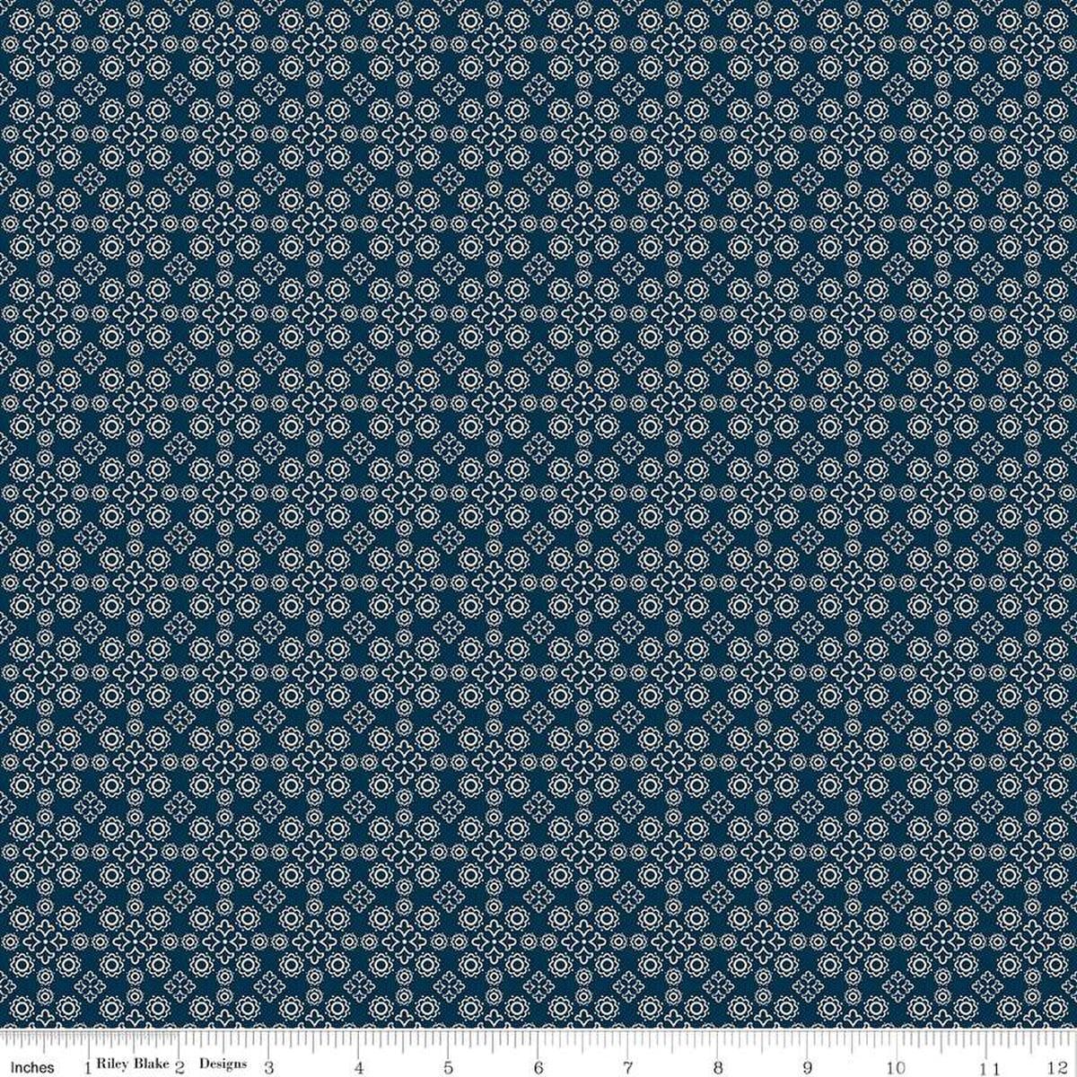 Image of the Cheddar at Twilight Medallion Navy quilting cotton fabric by Riley Blake Designs. Features geometric medallion pattern on a dark orange background. 
Cute Little Fabric Shop