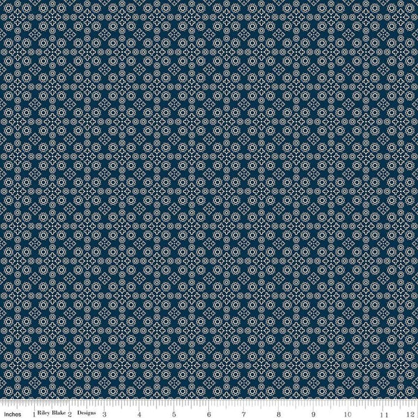 Image of the Cheddar at Twilight Medallion Navy quilting cotton fabric by Riley Blake Designs. Features geometric medallion pattern on a dark orange background. 
Cute Little Fabric Shop