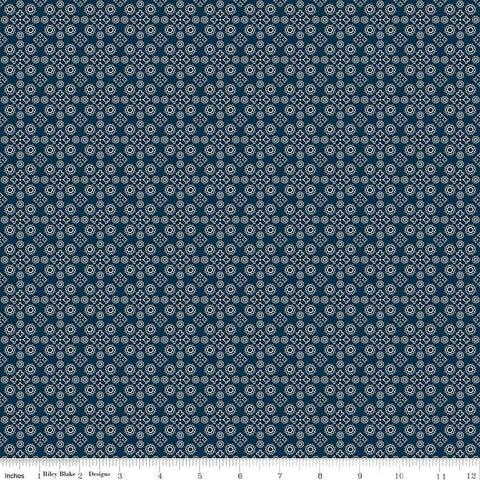 Image of the Cheddar at Twilight Medallion Navy quilting cotton fabric by Riley Blake Designs. Features geometric medallion pattern on a dark orange background. 
Cute Little Fabric Shop