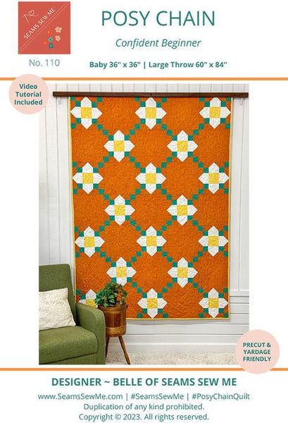 Image of the Posy Chain quilt by Seams Sew Me by Moda Fabrics. Features a flower pattern with a grid background border on an orange background. 
Cute Little Fabric Shop