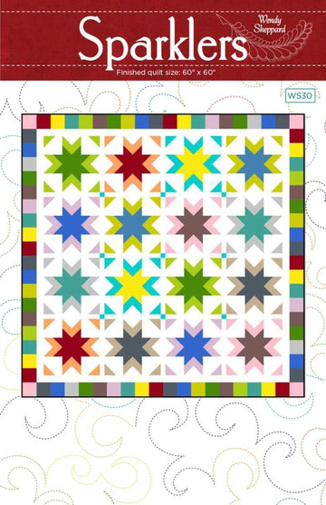 Image of the Sparklers quilt pattern by Wendy Sheppard for Riley Blake Designs. Features stars on a white background. 
Cute Little Fabric Shop