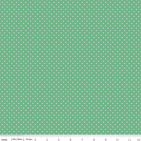 Image of the Swiss Dot Aprigot quilting cotton fabric by The RBD Designers for Riley Blake Designs. Features white dots on green swiss dots. 
Cute Little Fabric Shop