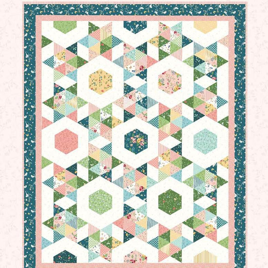 Image of the Starlight quilt pattern by Beverly McCullough for Riley Blake Designs. Features a geometric pattern with a teal bordered quilt. 
Cute Little Fabric Shop