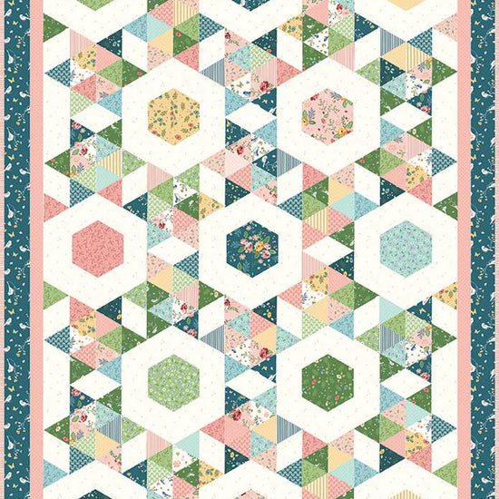 Image of the Starlight quilt pattern by Beverly McCullough for Riley Blake Designs. Features a geometric pattern with a teal bordered quilt. 
Cute Little Fabric Shop