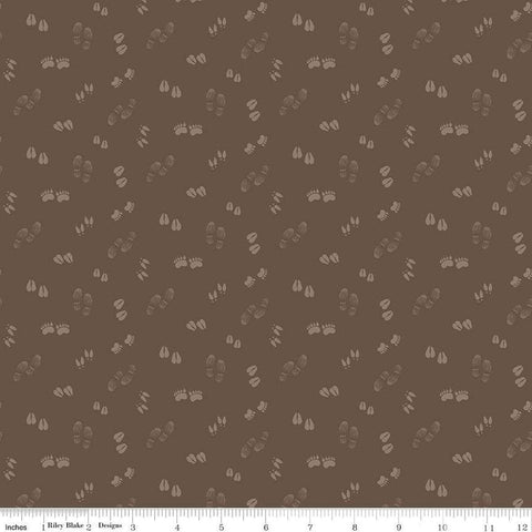 Image of the Lets Get Lost in the Woods Tracks Brown quilting cotton fabric by Tara Reed for Riley Blake Designs. Features tone on tone animal tracks on a dark brown background. 
Cute Little Fabric Shop